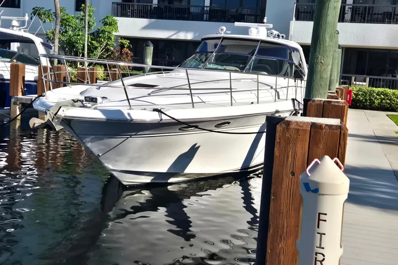 Slide: The Image of 2000 Sea Ray 540 Sundancer yacht docked at marina, sunny day. - 11