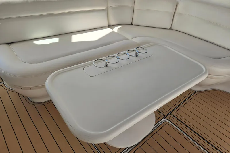 Slide: The Image of Luxurious seating area on a 2000 Sea Ray 540 Sundancer yacht with a sleek table. - 15