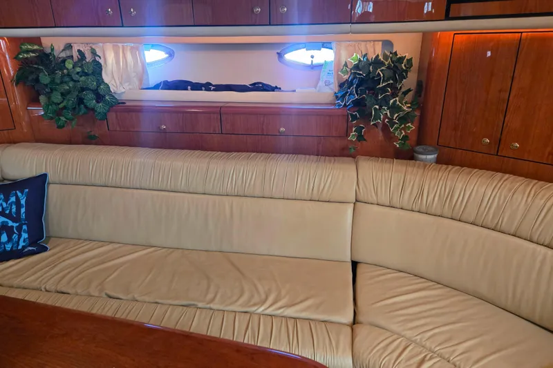 Slide: The Image of Luxurious interior of 2000 Sea Ray 540 Sundancer yacht with leather seating and wood cabinetry. - 38