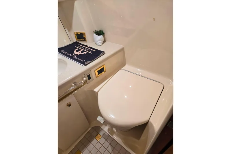 Slide: The Image of Luxurious bathroom in 2000 Sea Ray 540 Sundancer yacht, featuring elegant fixtures and decor. - 49