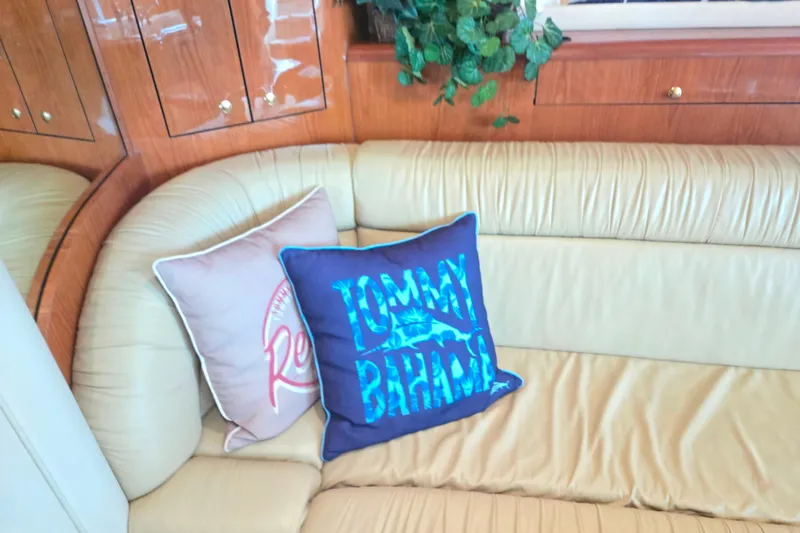 Slide: The Image of Luxurious interior of 2000 Sea Ray 540 Sundancer with decorative cushions and wood paneling. - 53