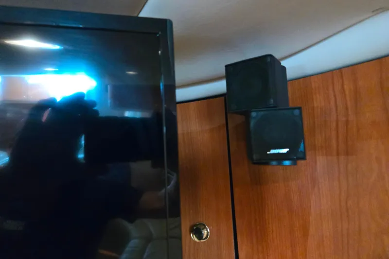 Slide: The Image of Interior of 2000 Sea Ray 540 Sundancer with Bose speakers and wooden paneling. - 55