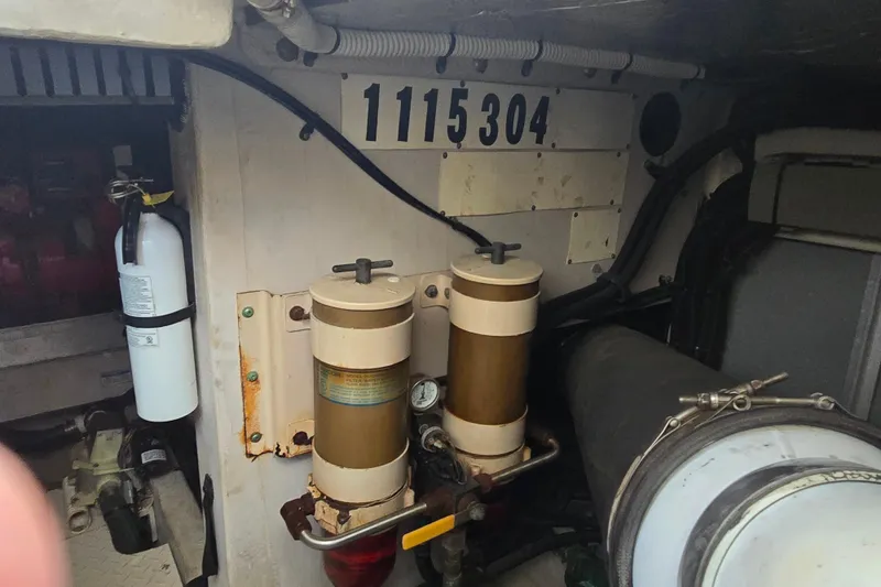 Slide: The Image of Engine room of 2000 Sea Ray 540 Sundancer with fire extinguisher and equipment. - 60