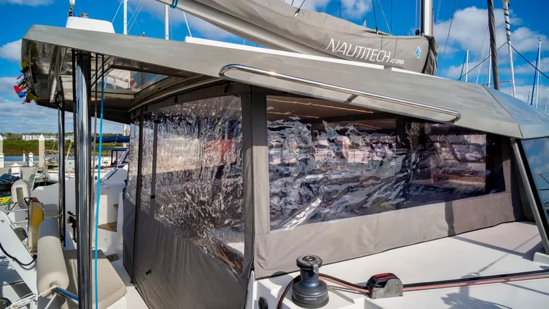 Slide: The Image of Nautitech 40 Open 2019 catamaran with enclosed cabin at the marina. - 11