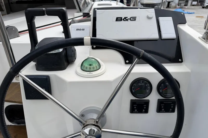 Slide: The Image of Steering wheel and navigation instruments on 2019 Nautitech 40 Open catamaran. - 14