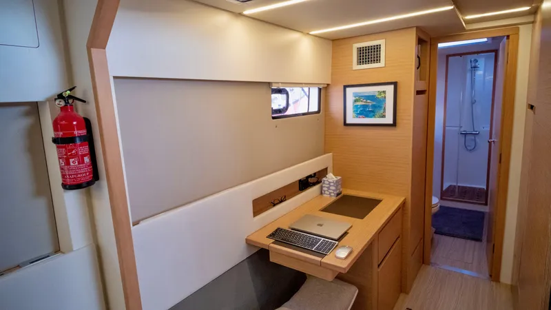 Slide: The Image of Interior of 2019 Nautitech 40 Open with desk and bathroom. - 30