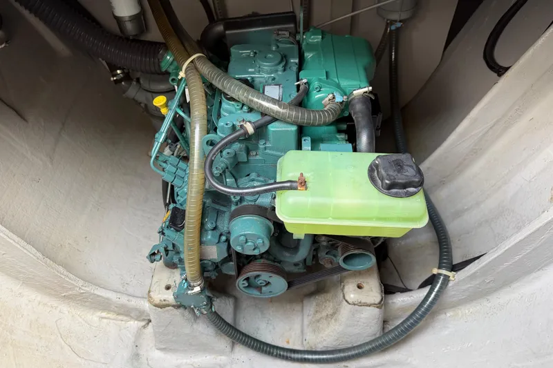 Slide: The Image of Engine compartment of a 2019 Nautitech 40 Open catamaran, featuring a green marine engine. - 48