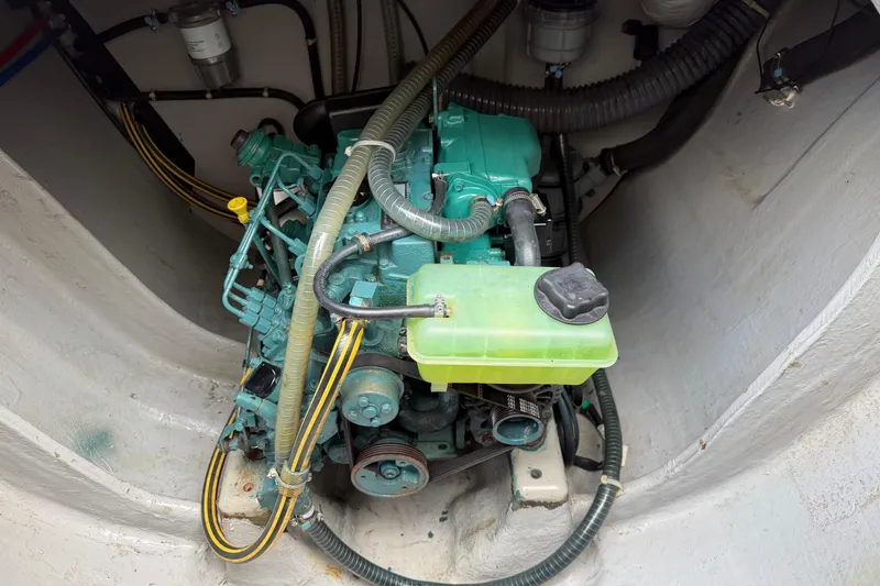 Slide: The Image of Engine compartment of a 2019 Nautitech 40 Open catamaran, showcasing mechanical components. - 49