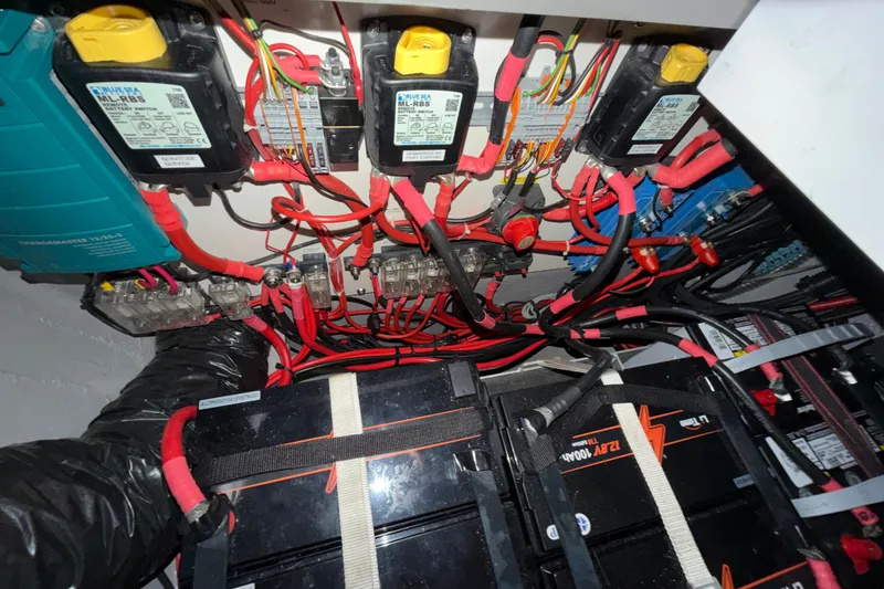 Slide: The Image of Electrical system of a 2019 Nautitech 40 Open, featuring batteries and wiring. - 52