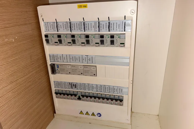 Slide: The Image of Electrical panel on a 2019 Nautitech 40 Open catamaran, labeled 125 Vac. - 56