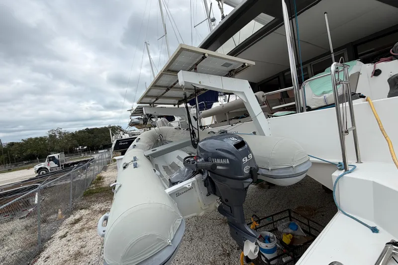 Slide: The Image of 2019 Nautitech 40 Open catamaran with Yamaha outboard motor and dinghy on deck. - 59