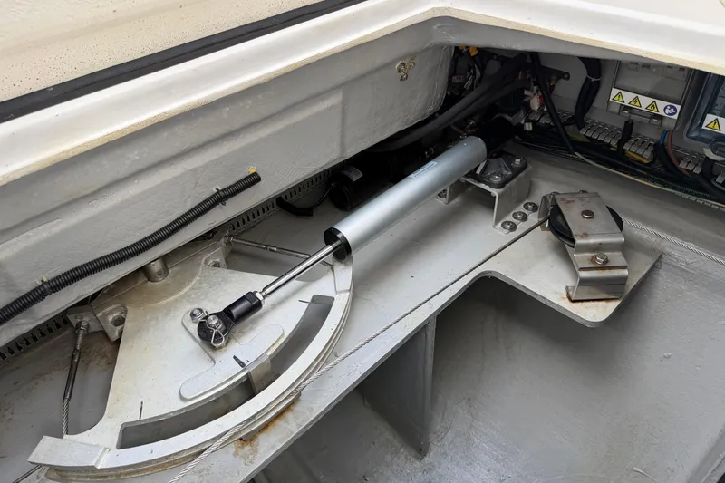 Slide: The Image of Steering mechanism of 2019 Nautitech 40 Open catamaran, showcasing hydraulic components and cables. - 61