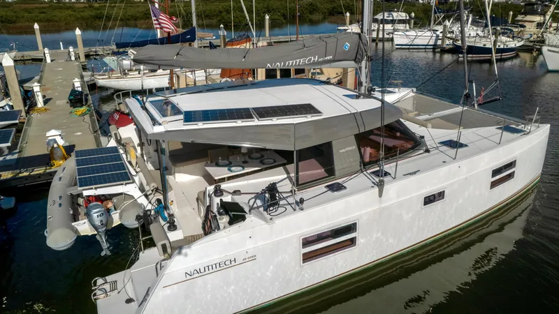 Slide: The Image of 2019 Nautitech 40 Open catamaran docked at marina. - 7