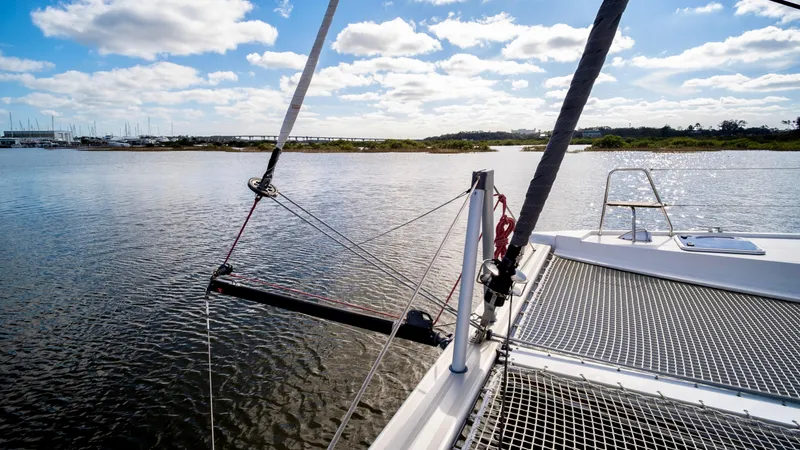 Slide: The Image of Nautitech 40 Open 2019 on calm water with blue sky. - 9
