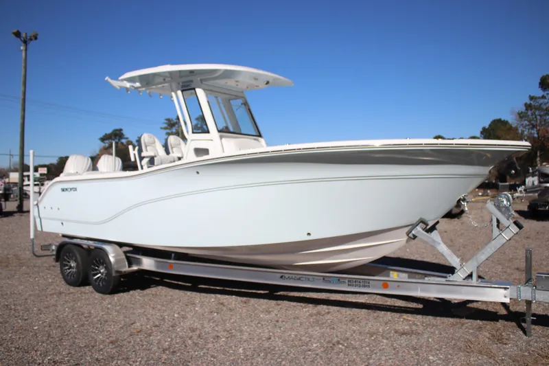 The Image of 2026 Sea Fox 268 Commander boat on trailer, side view under clear blue sky. - 0