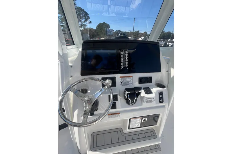 Slide: The Image of 2026 Sea Fox 268 Commander boat with Yamaha engines and seating area. - 10