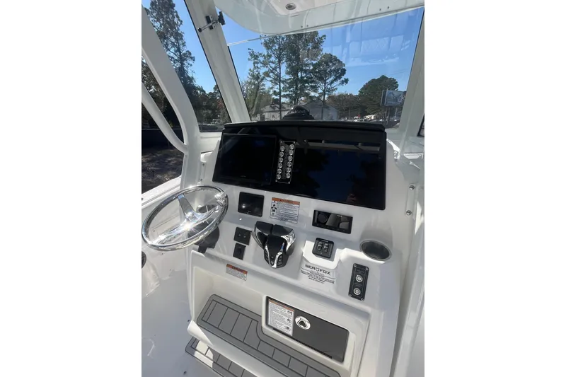 Slide: The Image of 2026 Sea Fox 268 Commander boat with dual outboard engines on a trailer. - 11