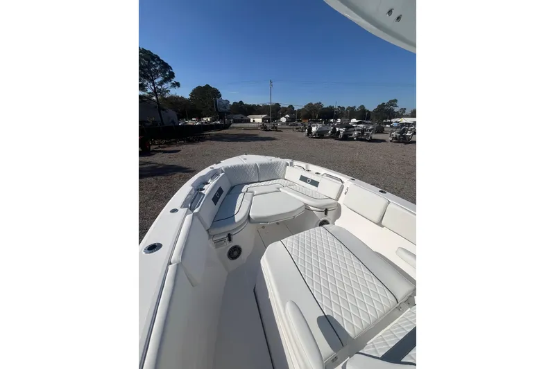 Slide: The Image of 2026 Sea Fox 268 Commander boat interior with cushioned seating and storage. - 12