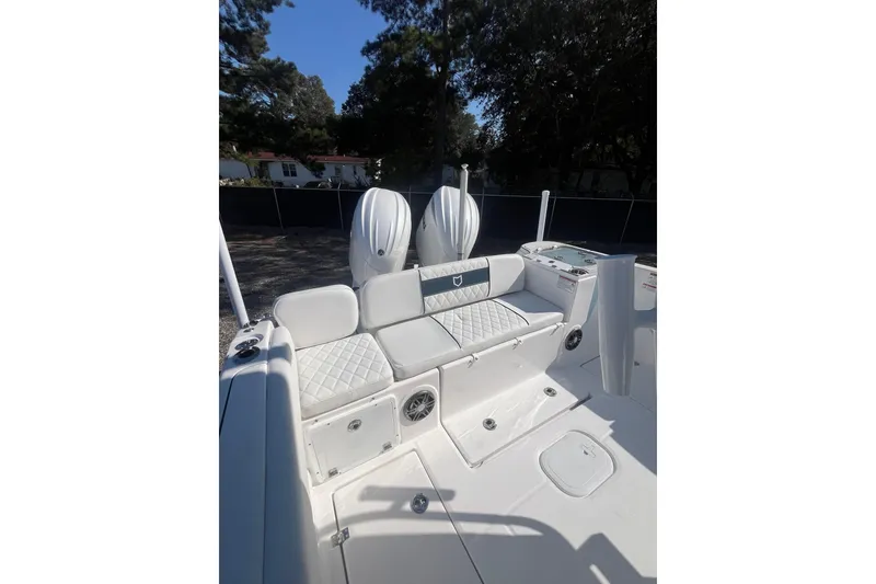 Slide: The Image of Open anchor compartment on 2026 Sea Fox 268 Commander boat, showcasing storage and seating. - 16