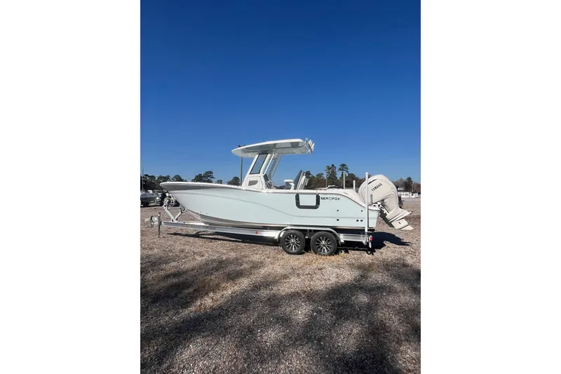 Slide: The Image of 2026 Sea Fox 268 Commander boat on trailer, parked outdoors. - 2