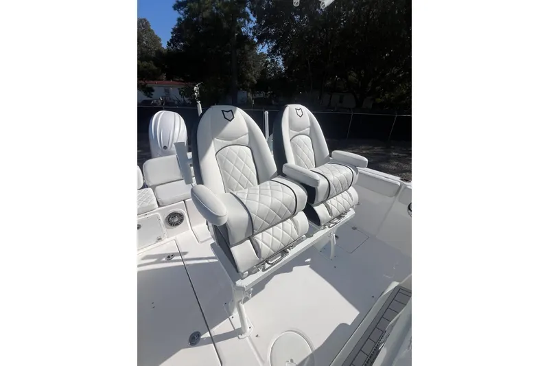 Slide: The Image of Luxury seating on 2026 Sea Fox 268 Commander boat, featuring plush, diamond-stitched upholstery. - 7