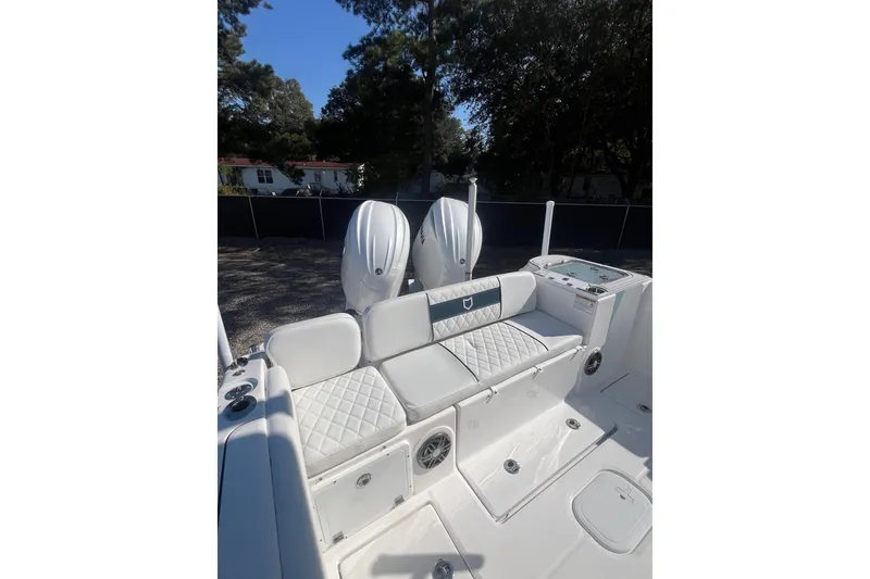 Slide: The Image of 2026 Sea Fox 268 Commander boat interior with cushioned seating and storage compartments. - 8
