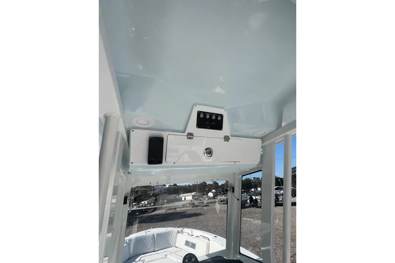 Slide: The Image of 2026 Sea Fox 268 Commander boat dashboard with steering wheel and control panel. - 9