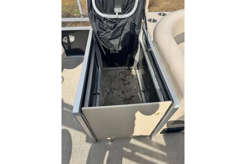 Slide: The Image of 2022 Avalon GS Rear Fish 25' storage compartment with open lid and interior view. - 10