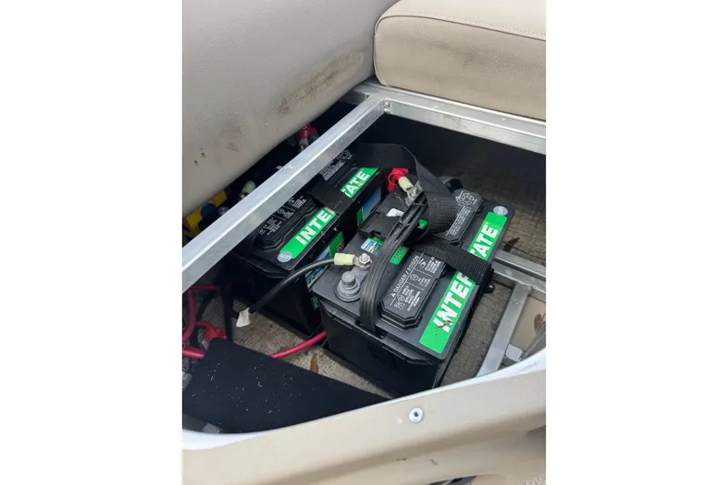 Slide: The Image of Batteries installed in a 2022 Avalon GS Rear Fish 25' boat compartment. - 19