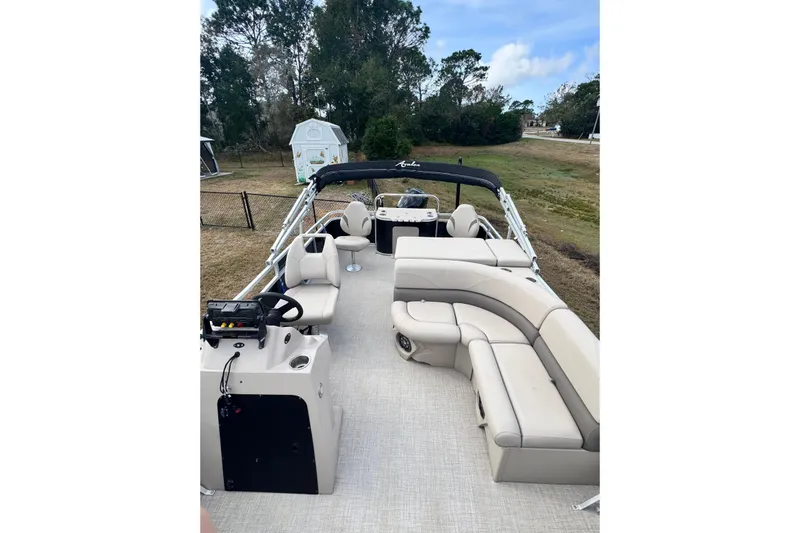 Slide: The Image of 2022 Avalon GS Rear Fish 25' pontoon boat with spacious seating and modern design. - 2