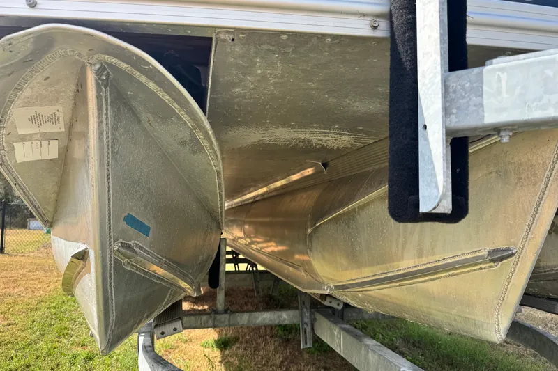 Slide: The Image of 2022 Avalon GS Rear Fish 25' pontoon boat underside on trailer. - 34