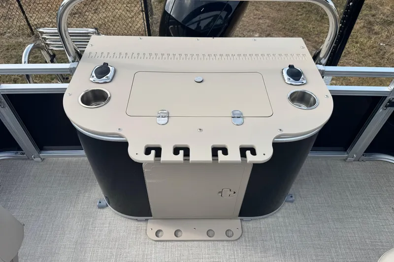 Slide: The Image of 2022 Avalon GS Rear Fish boat console with cup holders and storage compartment. - 7