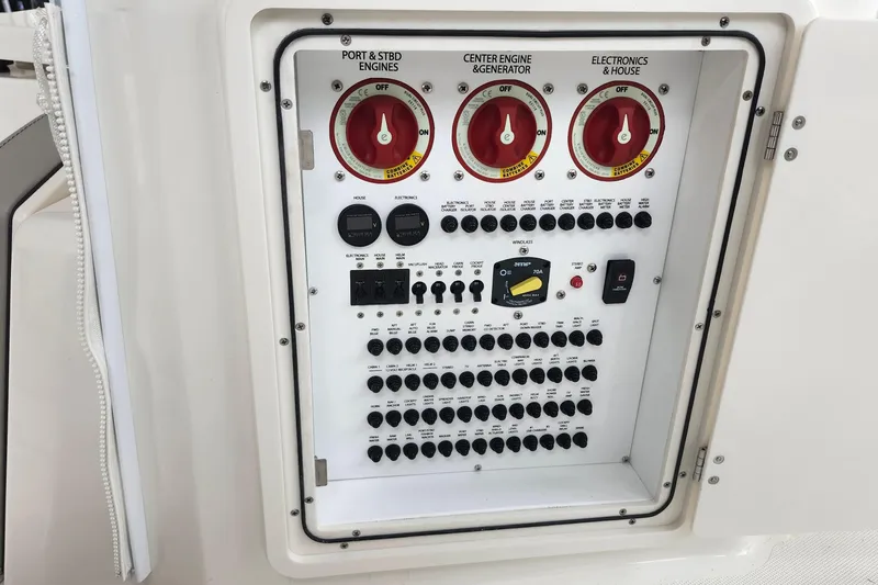 Slide: The Image of 2026 Pursuit OS 355 Offshore interior with cushioned seat and storage compartment. - 17