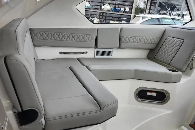 Slide: The Image of 2026 Pursuit OS 355 Offshore boat interior with sleek design and modern amenities. - 18