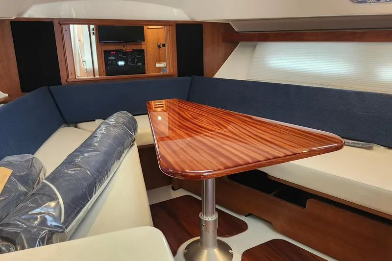 Slide: The Image of Helm of 2026 Pursuit OS 355 Offshore boat with steering wheel and control panel. - 23