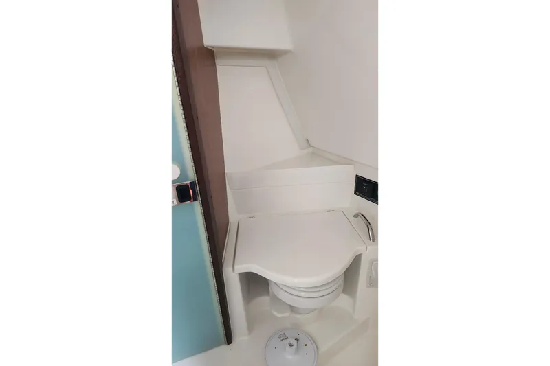 Slide: The Image of Interior of 2026 Pursuit OS 355 Offshore boat with TV and control panels. - 27