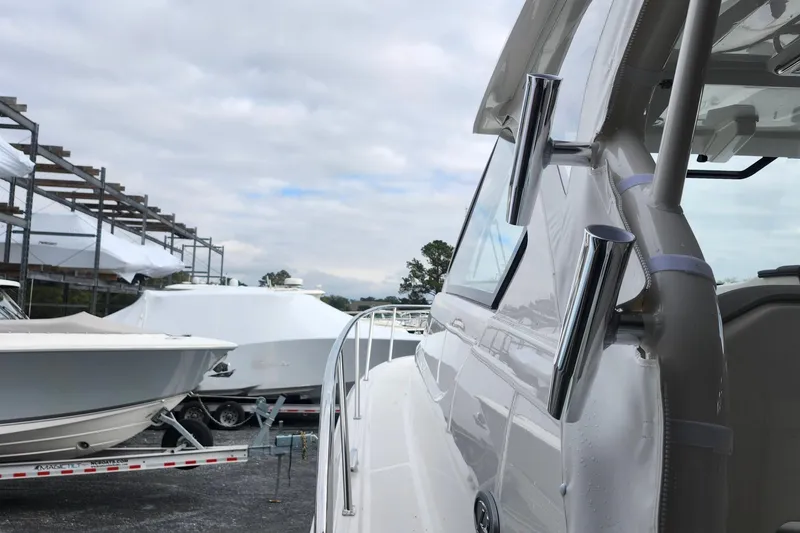 Slide: The Image of Triple Yamaha 350 V6 engines on a 2026 Pursuit OS 355 Offshore boat. - 4