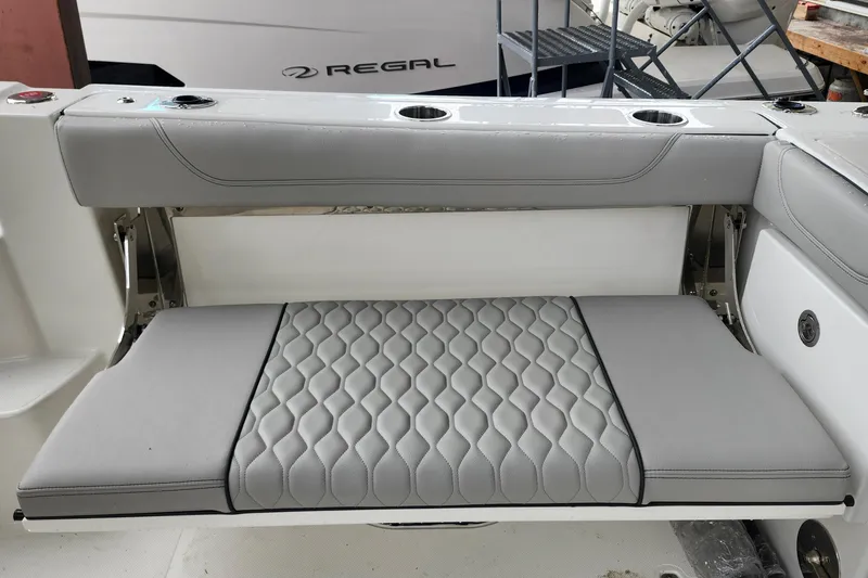 Slide: The Image of 2026 Pursuit OS 355 Offshore boat docked, showcasing sleek design and chrome details. - 7