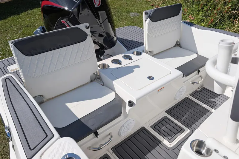 Slide: The Image of 2026 Bayliner Trophy T20CC boat interior with seating and storage compartments. - 11