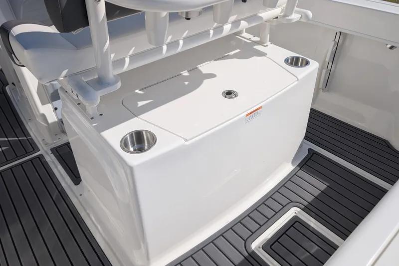 Slide: The Image of 2026 Bayliner Trophy T20CC boat interior with sleek seating and cup holders. - 12