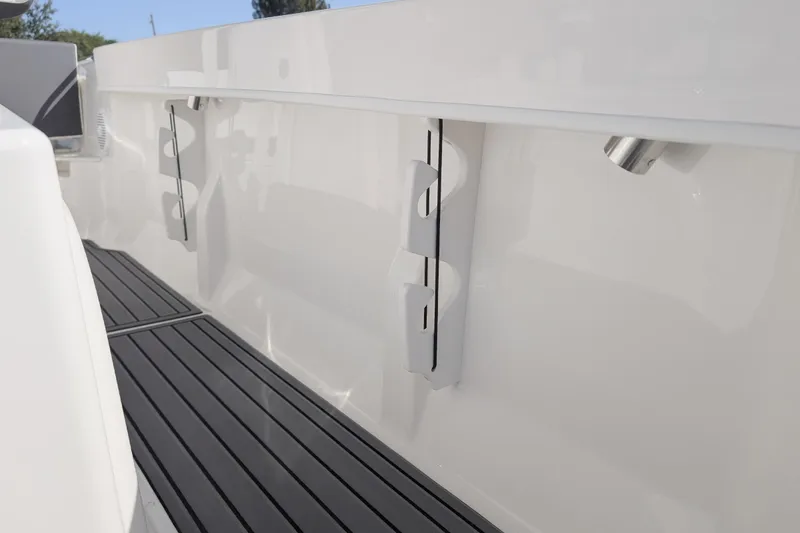 Slide: The Image of 2026 Bayliner Trophy T20CC boat interior with sleek white finish and modern fittings. - 13