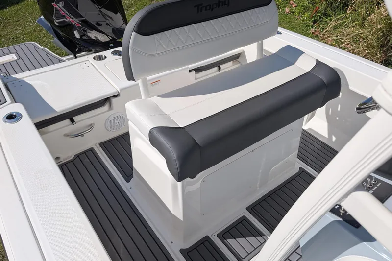 Slide: The Image of 2026 Bayliner Trophy T20CC boat interior with cushioned seating and sleek design. - 8