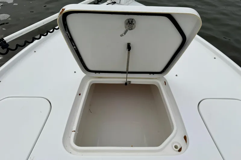 Slide: The Image of Open storage compartment on 2022 Sea Hunt BX 22 BR boat deck. - 10