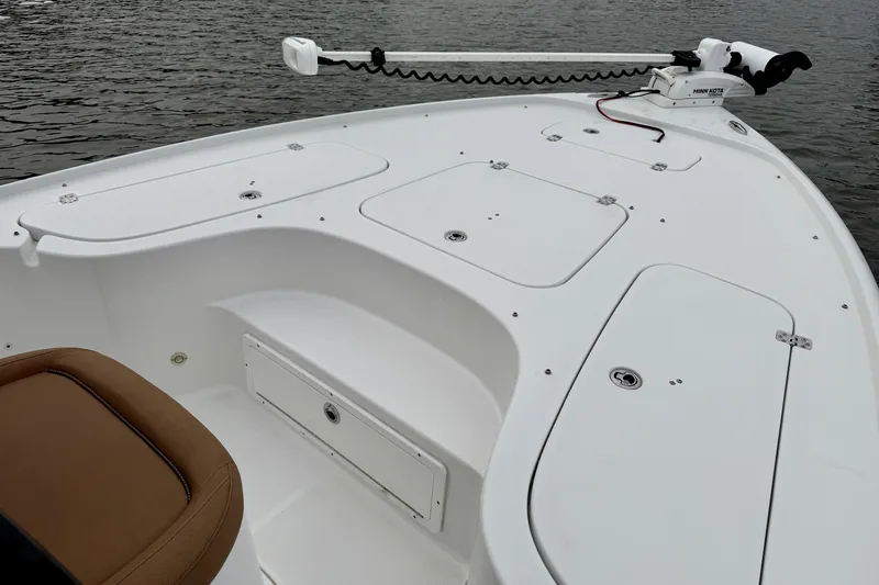 Slide: The Image of 2022 Sea Hunt BX 22 BR boat deck with storage compartments and trolling motor. - 13