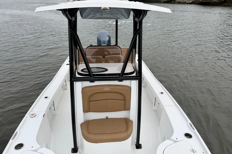 Slide: The Image of 2022 Sea Hunt BX 22 BR boat on water, featuring sleek design and comfortable seating. - 14