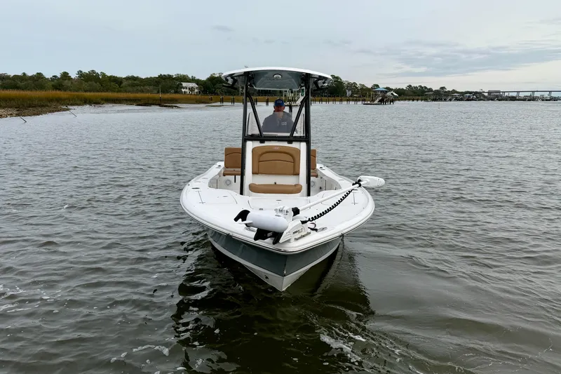 Slide: The Image of 2022 Sea Hunt BX 22 BR boat on calm water, featuring sleek design and modern equipment. - 2