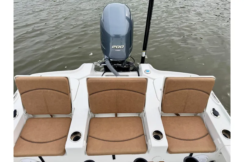 Slide: The Image of 2022 Sea Hunt BX 22 BR boat with Yamaha 200 engine and three tan seats. - 21