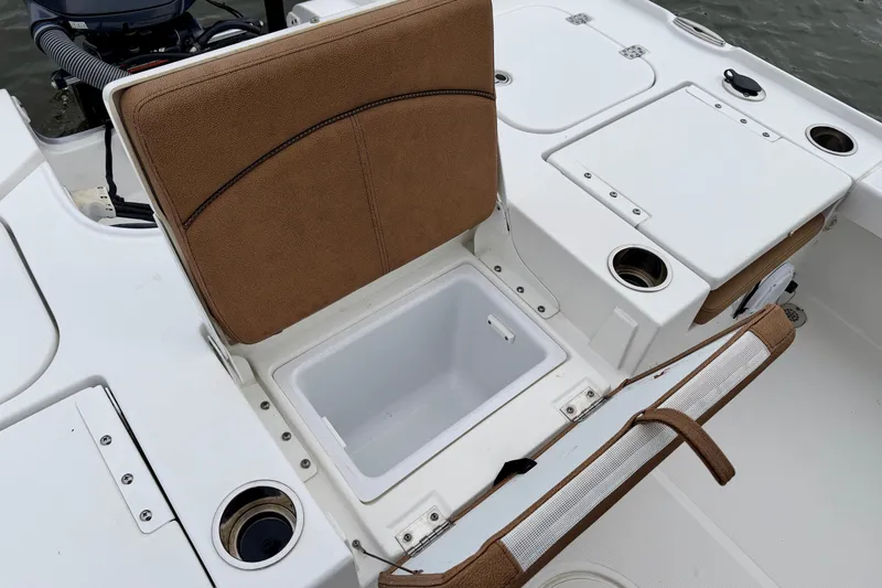 Slide: The Image of 2022 Sea Hunt BX 22 BR with open storage and seating area. - 25