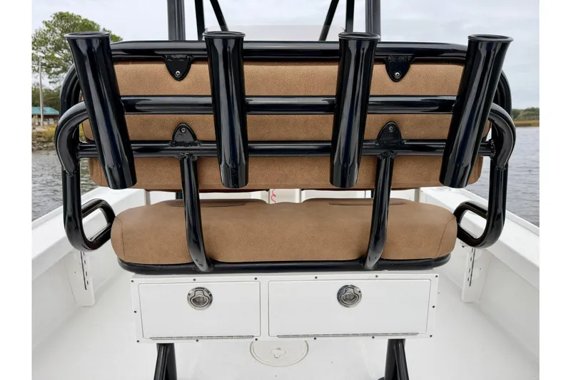 Slide: The Image of 2022 Sea Hunt BX 22 BR boat seating with rod holders and storage compartments. - 32