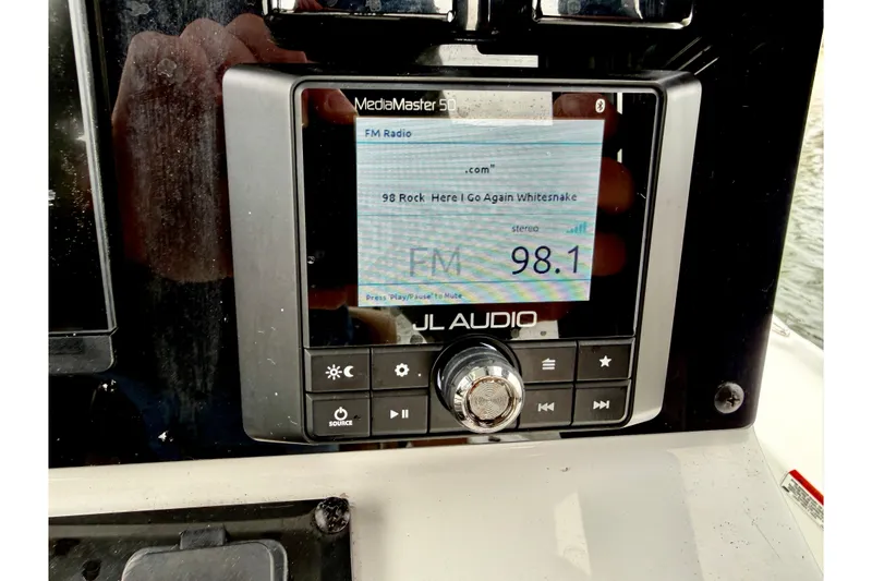 Slide: The Image of JL Audio MediaMaster 50 on 2022 Sea Hunt BX 22 BR displaying FM radio station 98.1. - 38